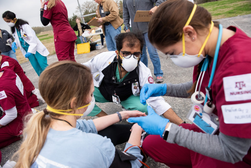 Students administer aid during Disaster Day.