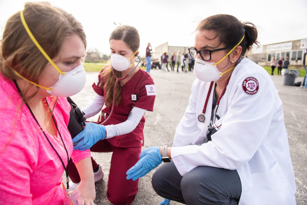 Students administer aid during Disaster Day.