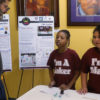 Nina Diaz and Eunell Williams explain their project to a FabLearn attendee.