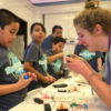 Angel Almendaris explains his project to a FabLearn attendee.