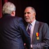 Texas A&M President Michael K. Young accepts the Walloon Merit Award from His Excellency Jean-Claude Marcourt.