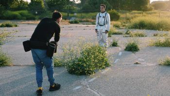 Matthew Edge being photographed for a book project during a break from pre-simulation training.