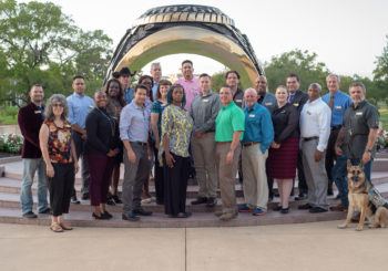 Members of the 2018 Entrepreneurship Bootcamp For Veterans class gather at the Haynes Ring Plaza.