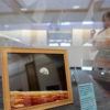 A photograph of the moon in a display case.