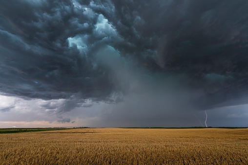 dark storm clouds over field