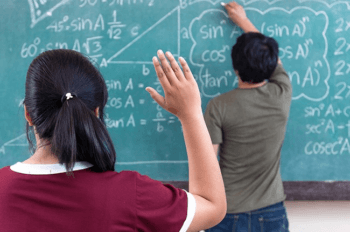 boy solving math equations