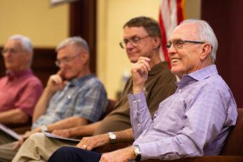 The four Storms brothers sit together as they tell stories about their father.