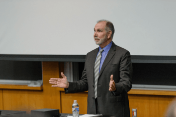 President Young speaking at the symposium