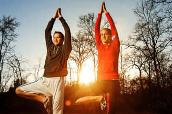two people doing yoga