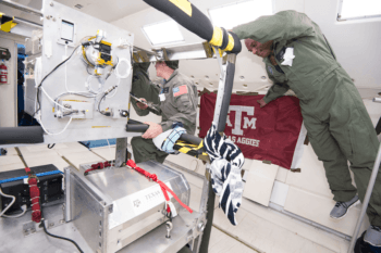 the NASA crew with the radiator system being tested during the flight