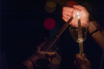 Muster candle lighting