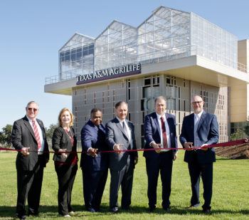 Ribbon cutting ceremony in front of building