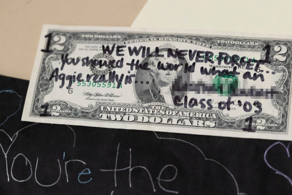 Dollar bill with note written for Bonfire victims