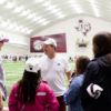 Jimbo Fisher talking to Aggie ACHIEVE students at football practice facility