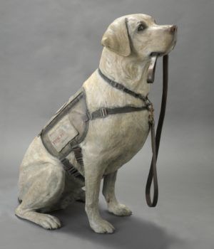 Statue of Sully holding leash