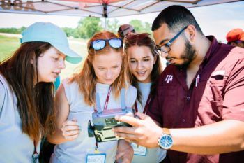 Luis Martinez helping high school students at the College of Geosciences 2019 GeoX camp.