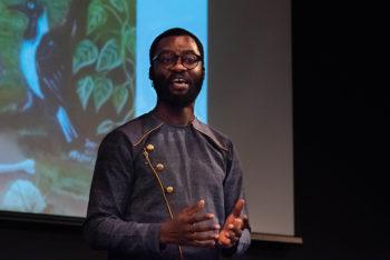 A photo of master's overall division and overall competition winner Edudzi David Sallah addressing the 3MT audience