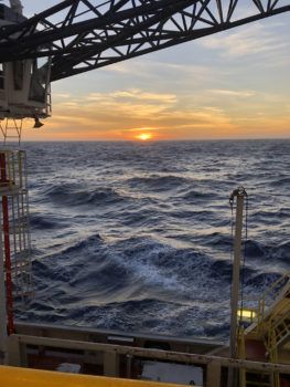 view of a sunset over the ocean from the boat