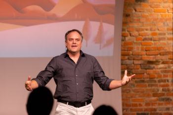 steven woltering gesturing at the front of a room