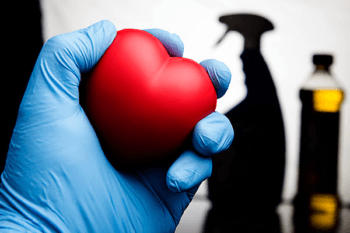 hand holding rubber heart