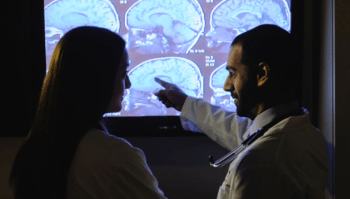 doctors looking at brain scans