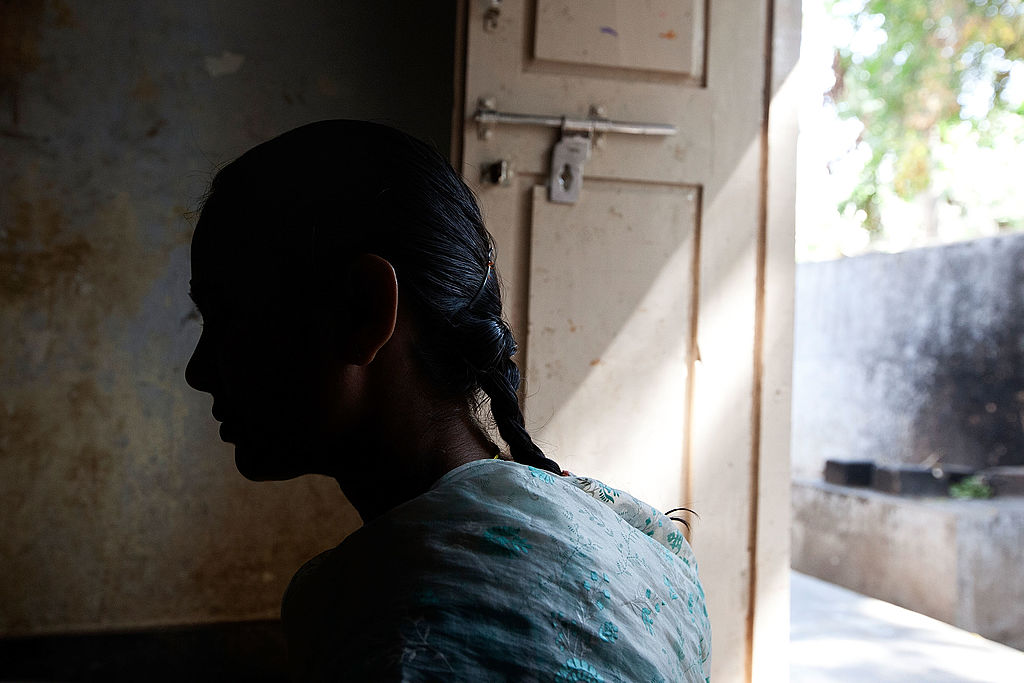 shadowed face of a woman in profile