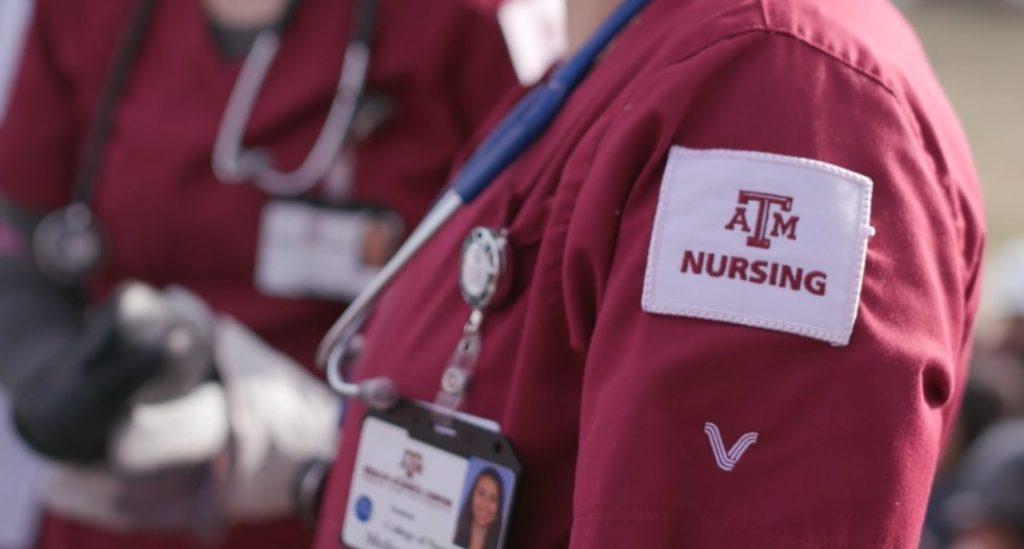 nursing student wearing maroon scrubs