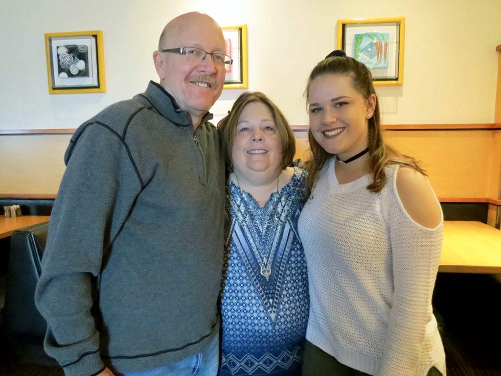 a photo of Clara Weitbrook and her parents