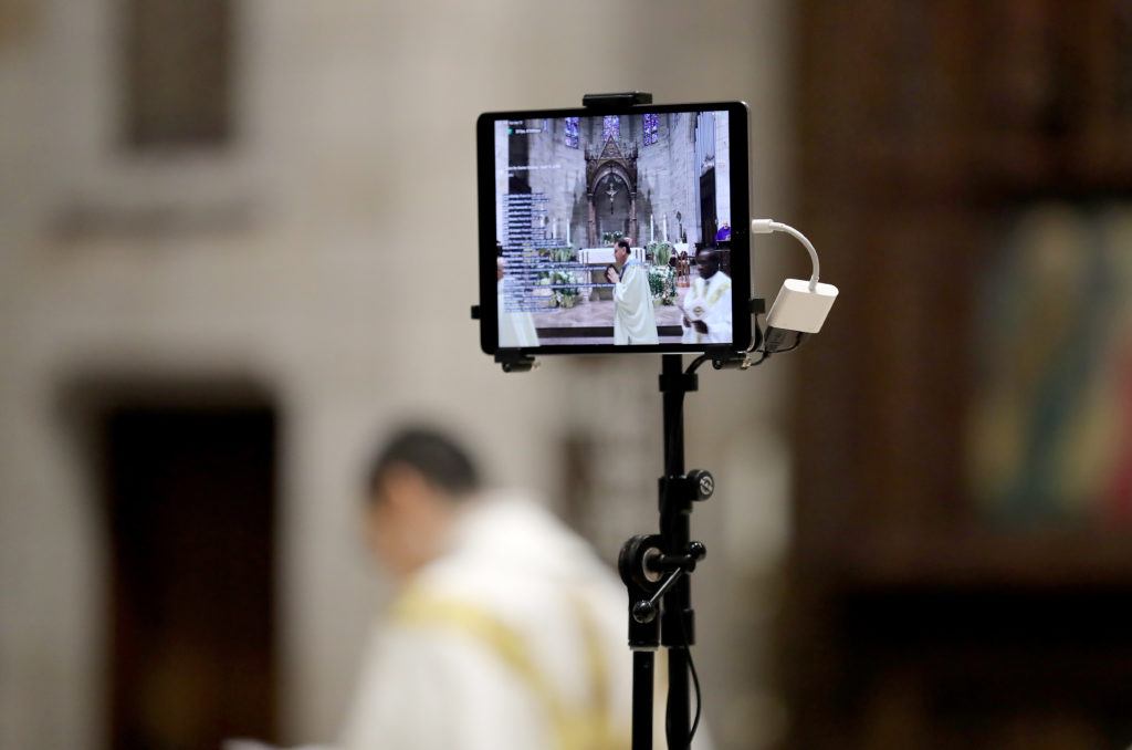 view of a livestream on an ipad of a catholic church mass
