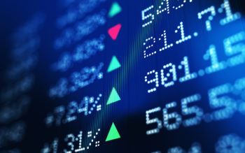a digital screen showing the prices of stocks