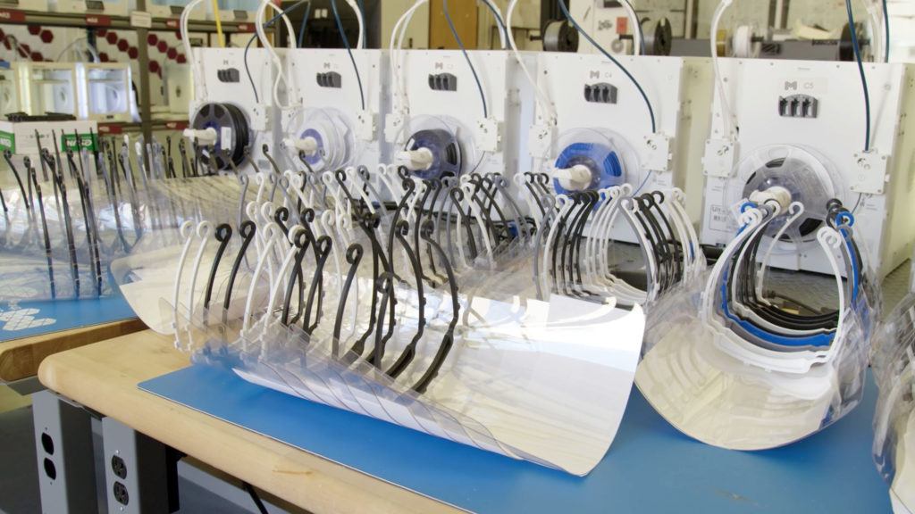 face shields lined up on table
