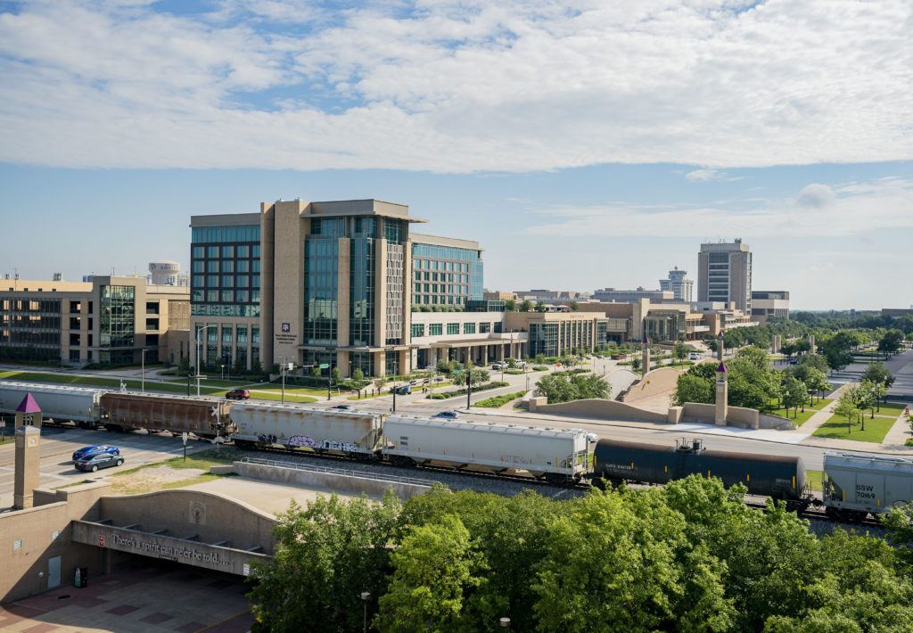 a train passes by the texas a&m campus