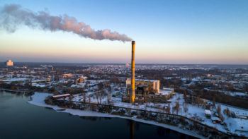 waste incenrator plant with smoking smokestack