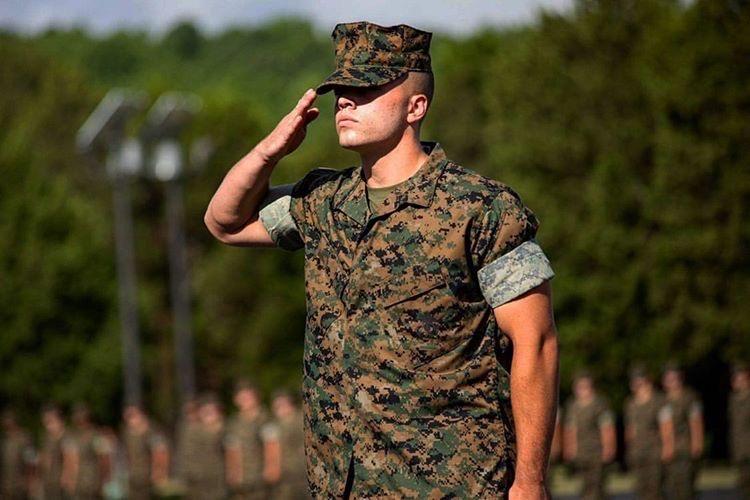 Cadet Dopp saluting in his fatigues