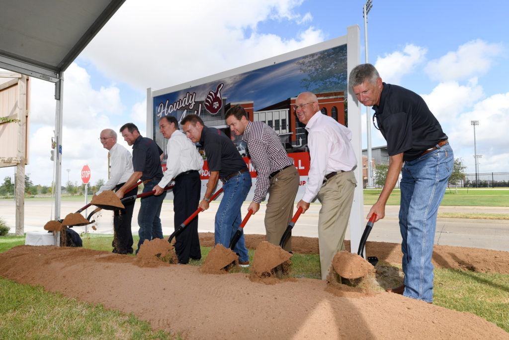 seven officials turning dirt at groundbreaking