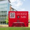 a Howdy Bubly sign with QR code