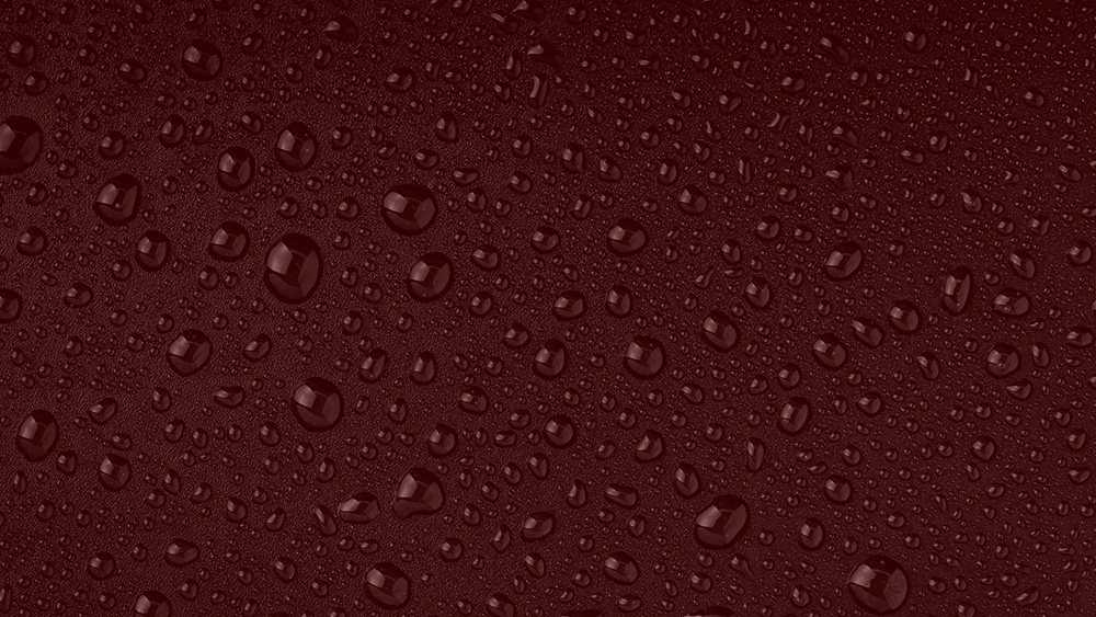 water droplets against maroon background
