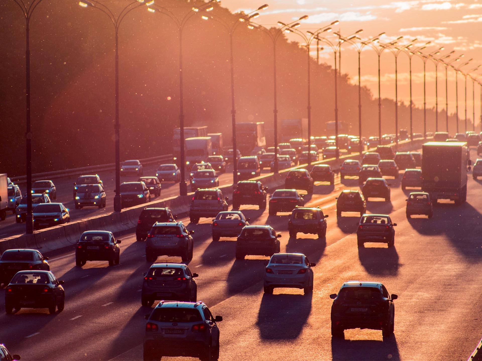 traffic on road at sunset