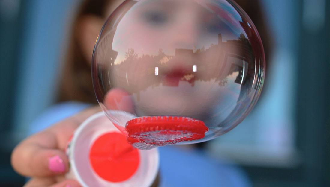 image of child's face behind bubble