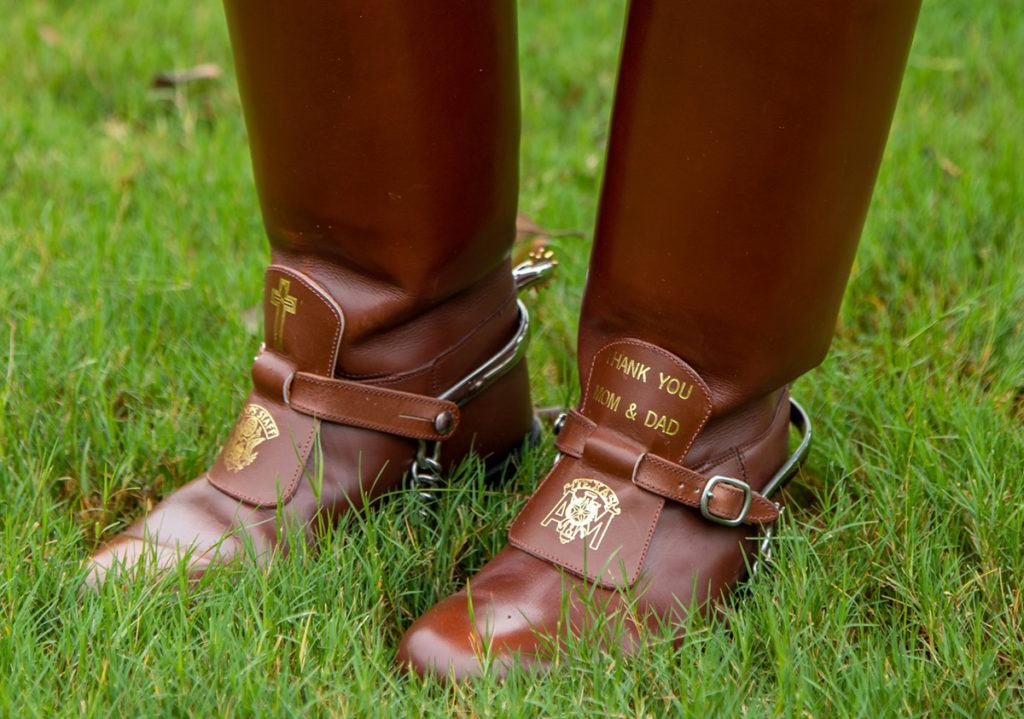 a closeup photo of Jazzlyn Gonzalez's boots that read "thank you mom and dad"