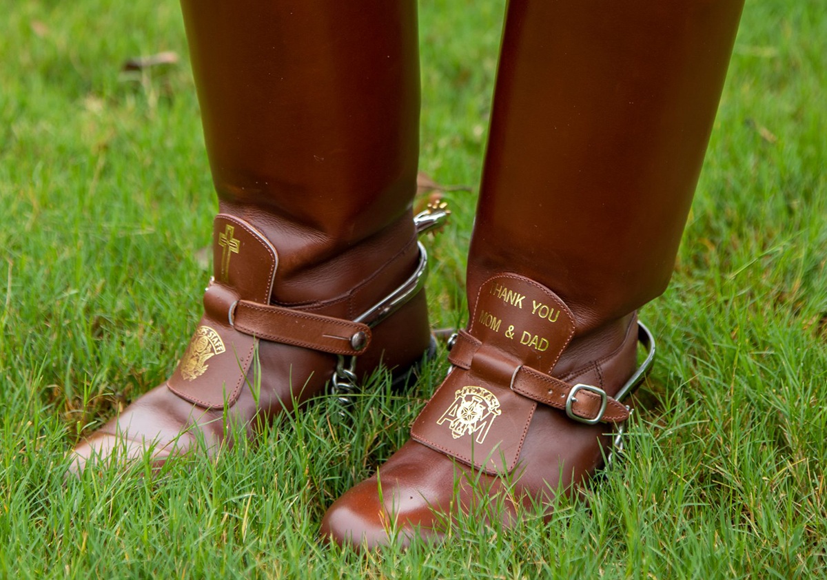 a closeup photo of Jazzlyn Gonzalez's boots that read "thank you mom and dad"