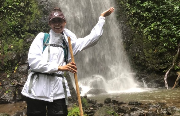 a photo of Alaya Keane on a previous trip to Brazil standing before a waterfall