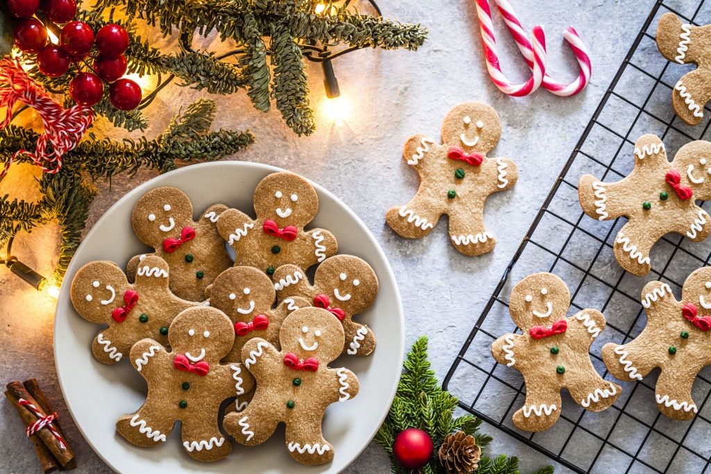 Top view of homemade cookies shot on gray table. with lights and decorations