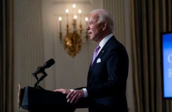 side view of joe biden speaking at podium