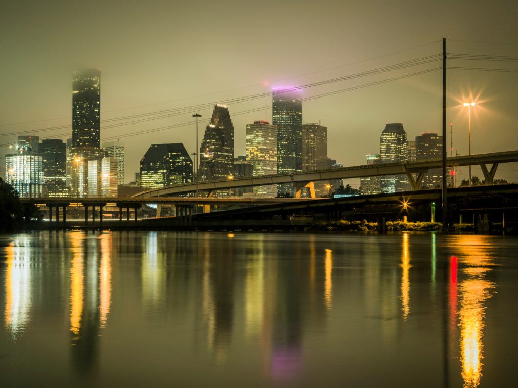 flooding in downtown houston with skyline in distance