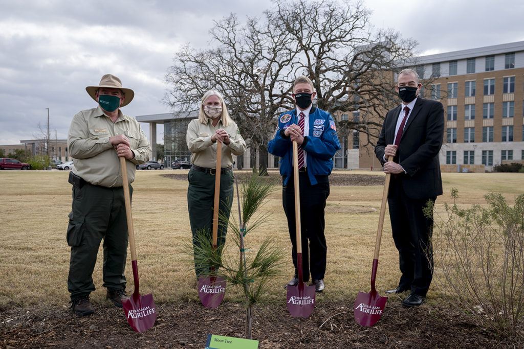 Tom Boggus, State Forester and Director, Texas A&M Forest Service; Jan Davis, Deputy Regional Forester for USDA Forest Service, Southern Region Col. Michael E. Fossum, Retired NASA astronaut and the Chief Operating Officer at Texas A&M University at Galveston and the Superintendent of the Texas A&M Maritime Academy; and Patrick Stover, Vice Chancellor and Dean of Agriculture and Life Sciences, and Director of AgriLife Research hold shovels at the site of the Moon Tree planting