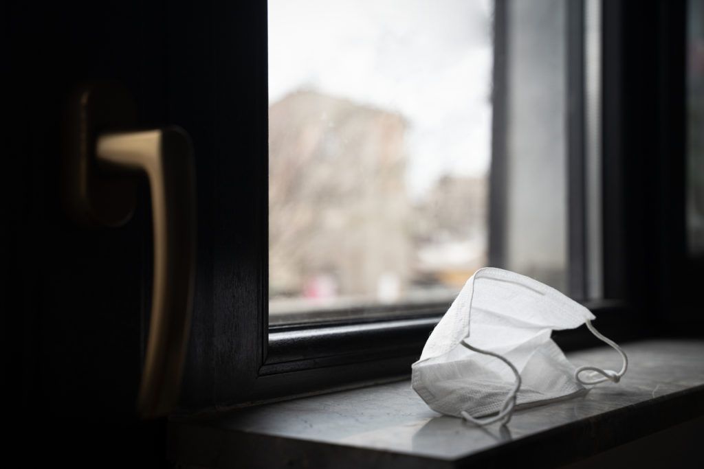 closeup of face mask on windowsill