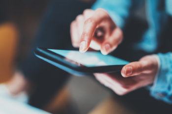 Closeup view of woman holding smartphone