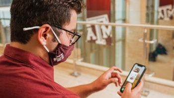 a photo of a man in the MSC using the HEB app