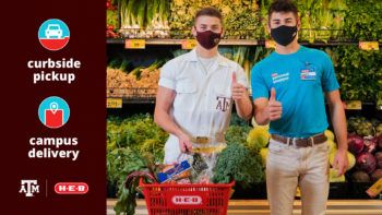 a photo of a Texas A&M Yell Leader giving the Gig 'em sign with an H-E-B personal shopper